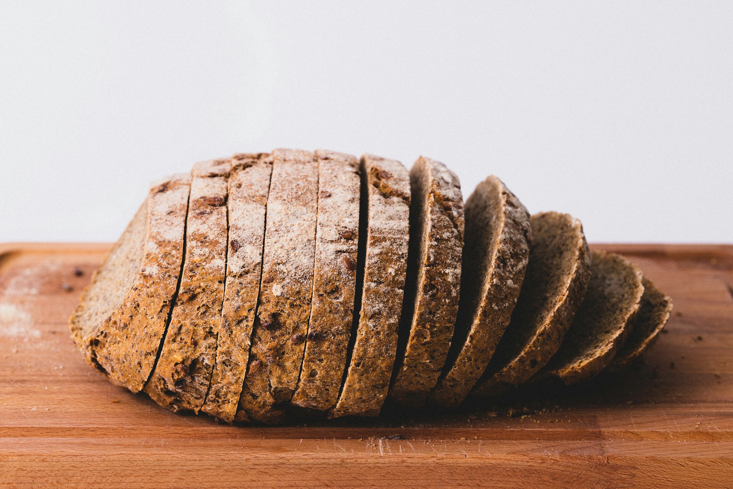 A dark-baked sourdough loaf resting on the counter